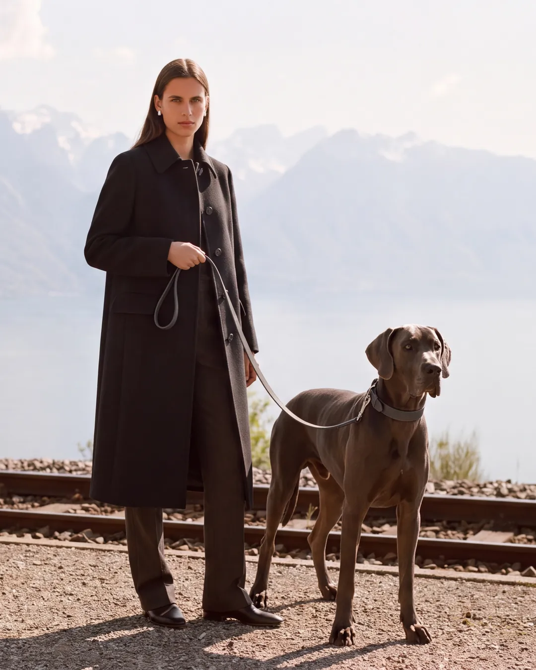 Woman and Cane Corso beside Lake Geneva in Montreux